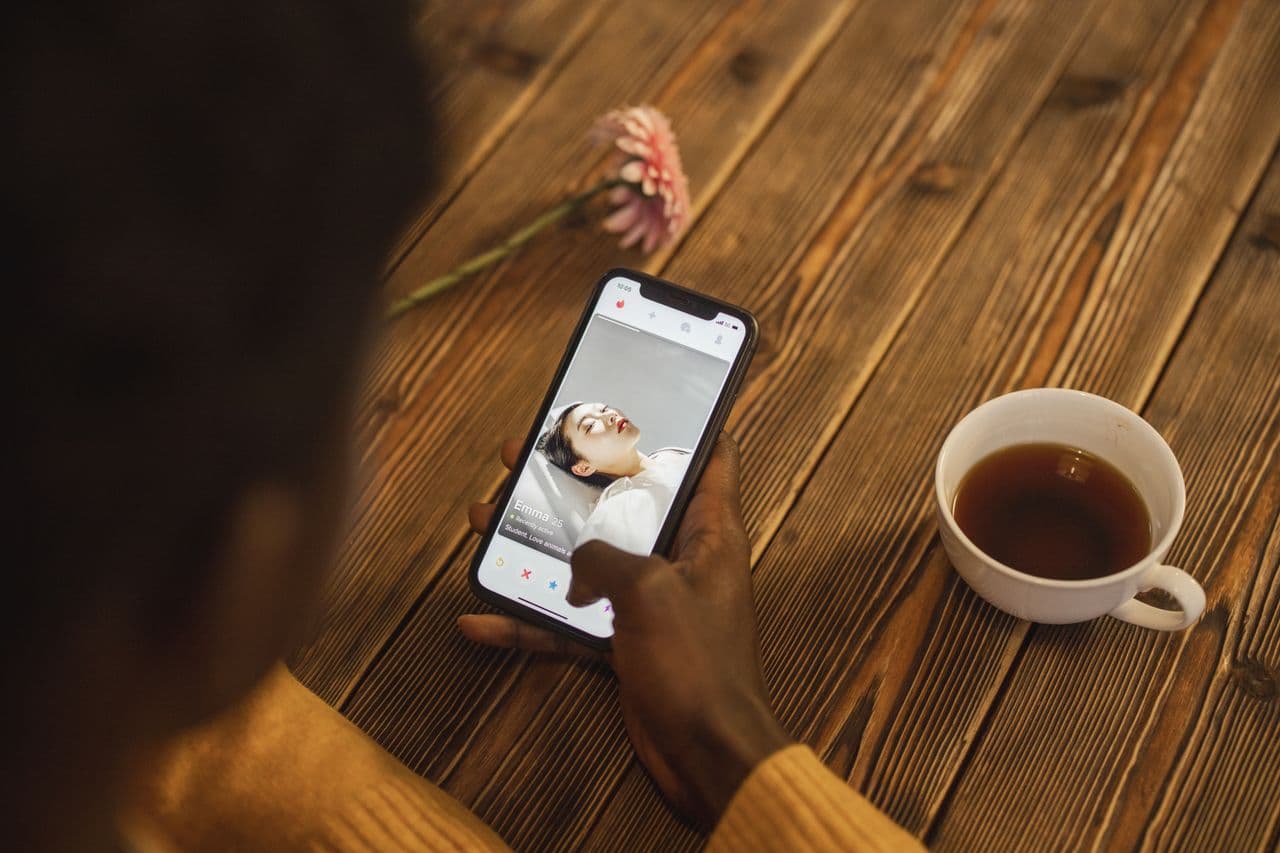 Person using a dating app on their phone
